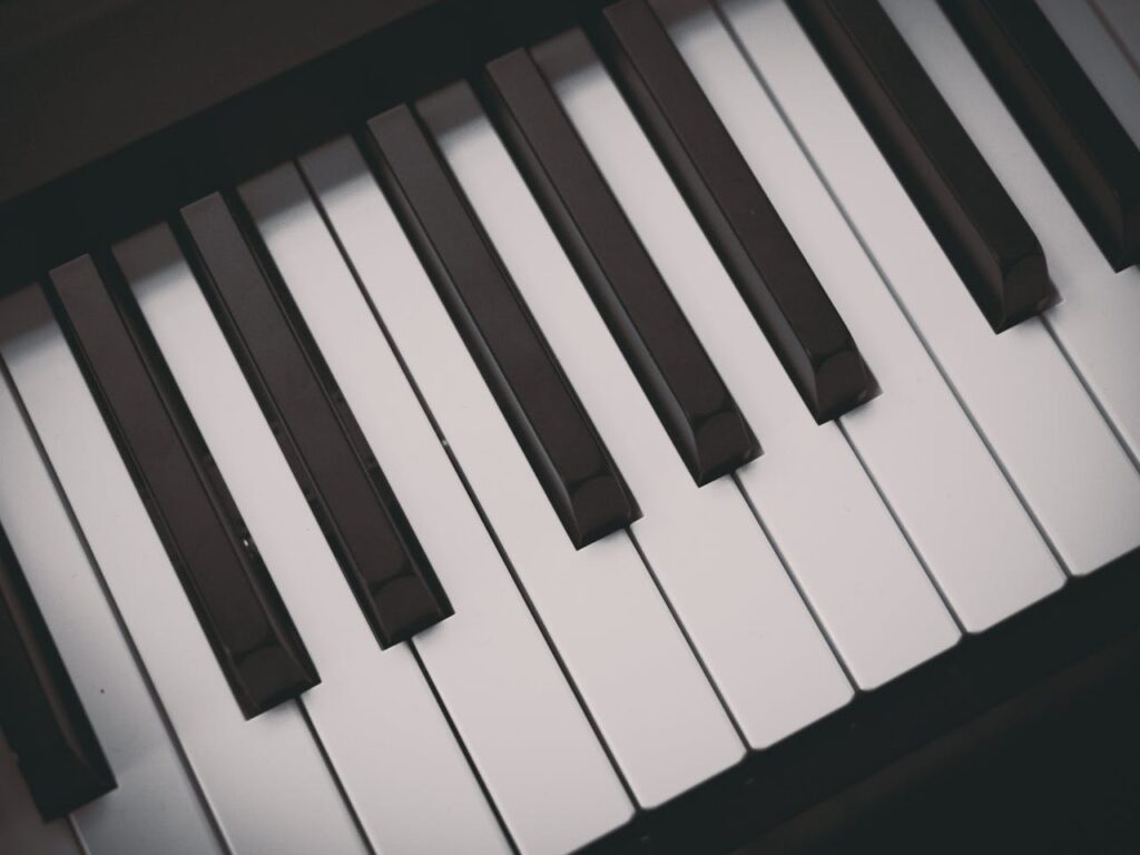 pexels-photo-258805 A detailed close-up image of black and white piano keys, showcasing musical elegance.